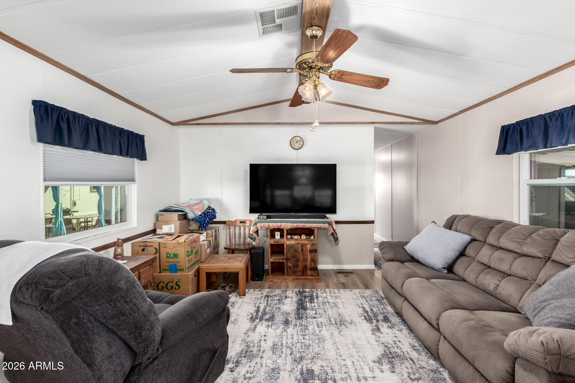 269 North Winchester Road, Unit 66 Apache Junction, AZ 85119 - Photo 5 of 28 a living room with furniture and a flat screen tv