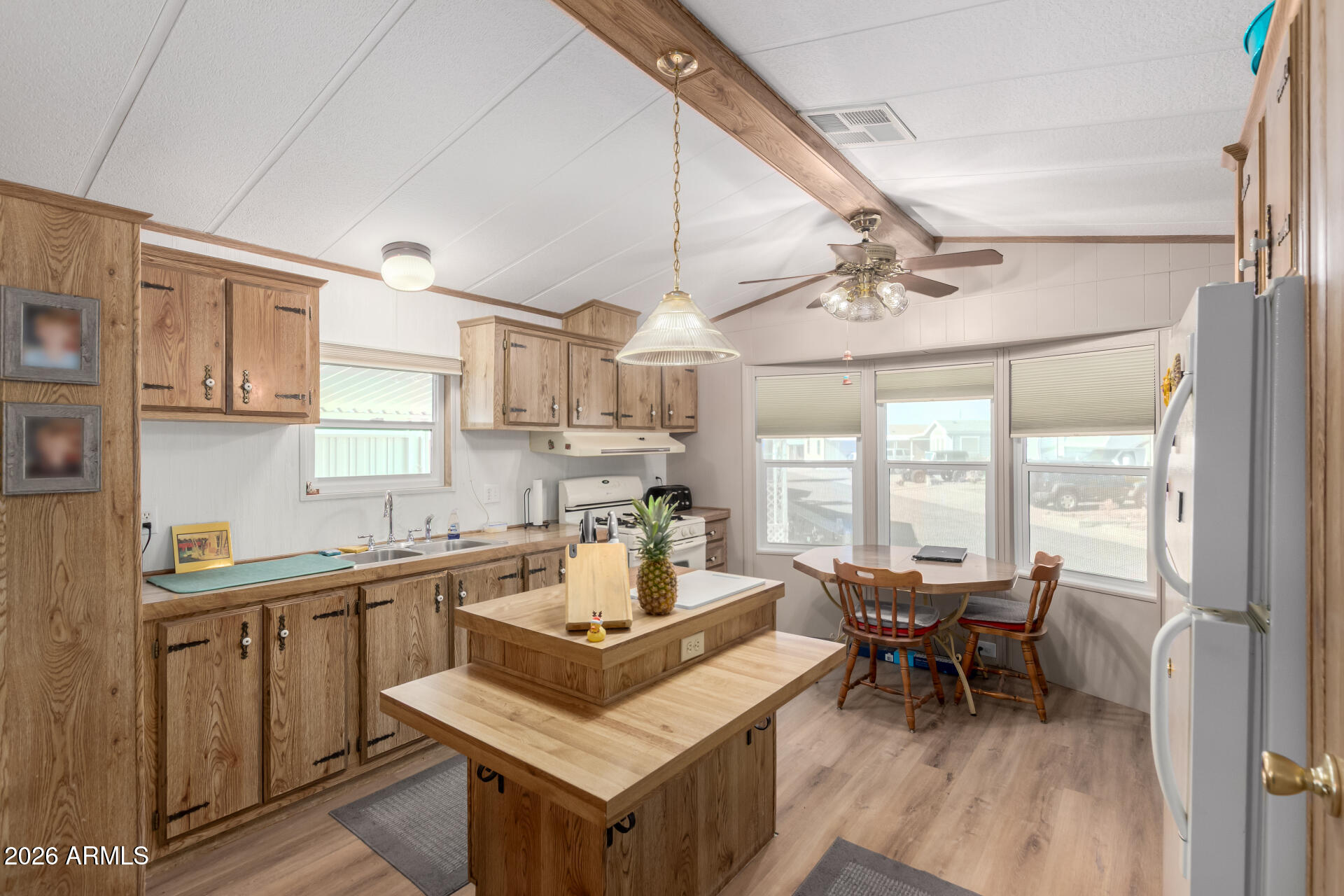 269 North Winchester Road, Unit 66 Apache Junction, AZ 85119 - Photo 10 of 28 a living room with stainless steel appliances granite countertop furniture and a kitchen view