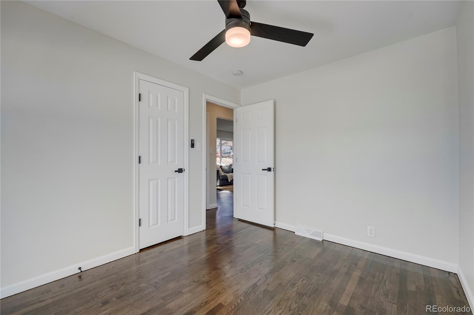 1635 South Raritan Street Denver, CO 80223 - Photo 11 of 17 wooden floor in an empty room
