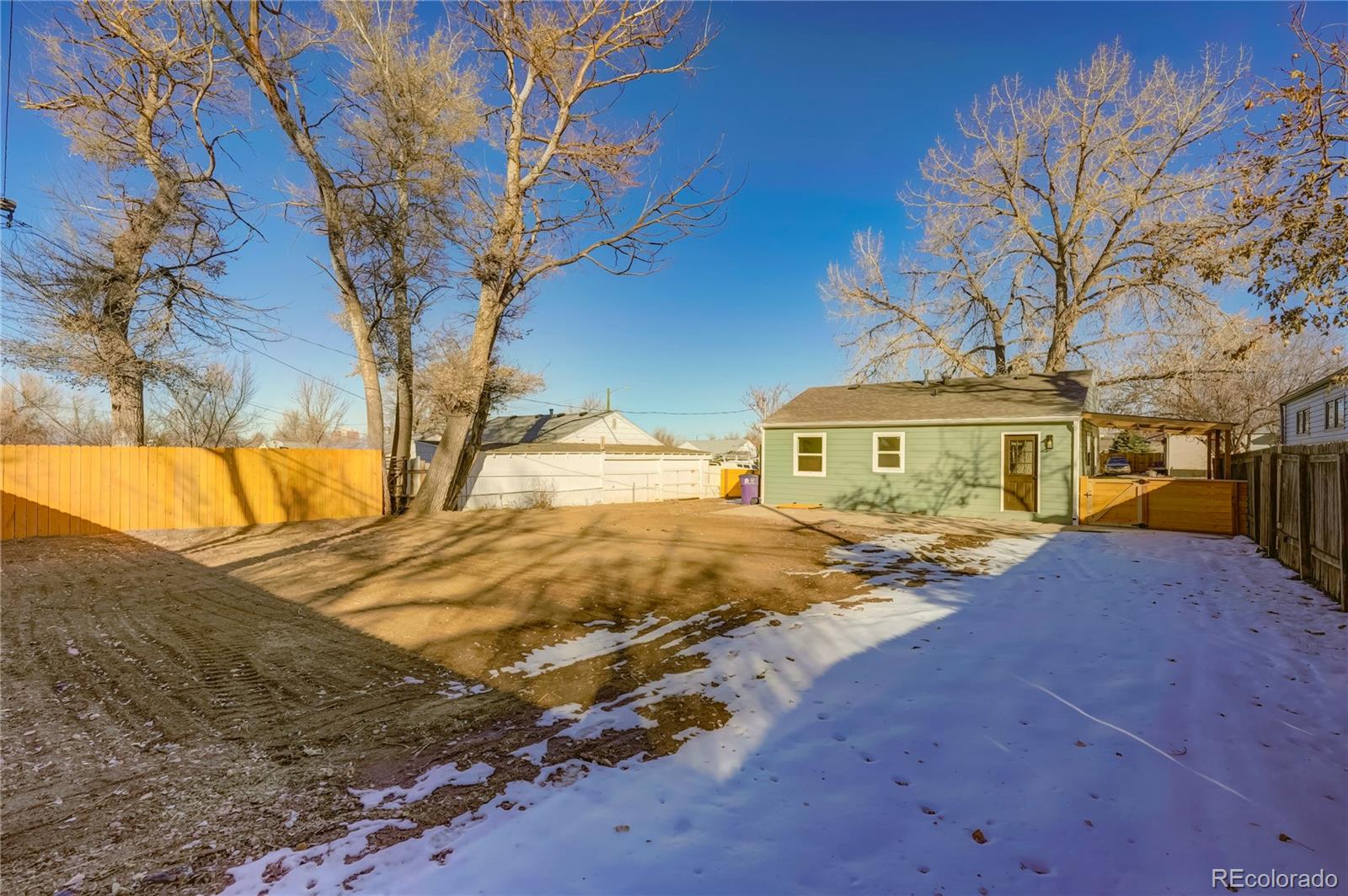 1635 South Raritan Street Denver, CO 80223 - Photo 17 of 17 a front view of a house with a yard