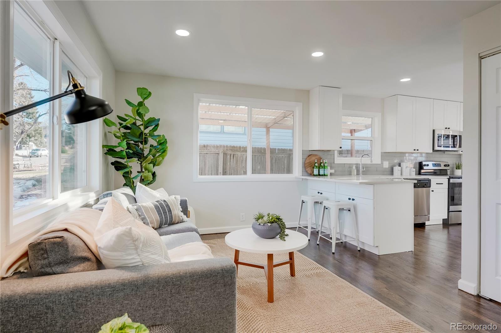 1635 South Raritan Street Denver, CO 80223 - Photo 4 of 17 a living room with furniture and a large window