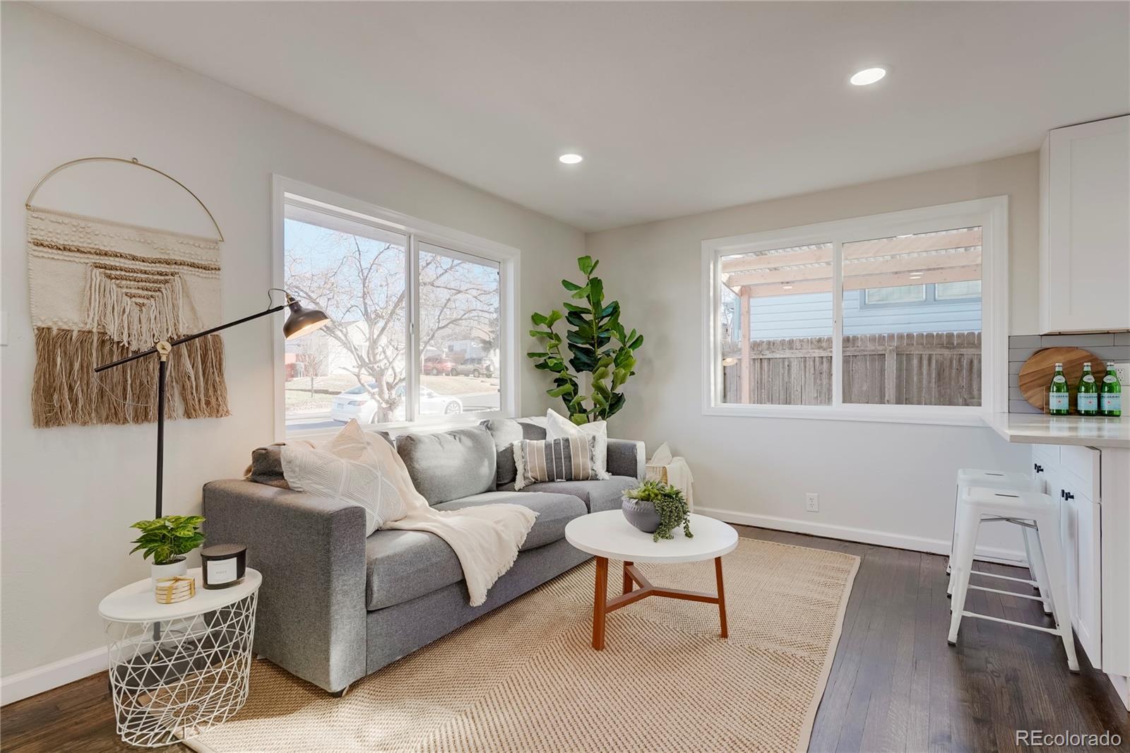 1635 South Raritan Street Denver, CO 80223 - Photo 5 of 17 a living room with furniture and a window