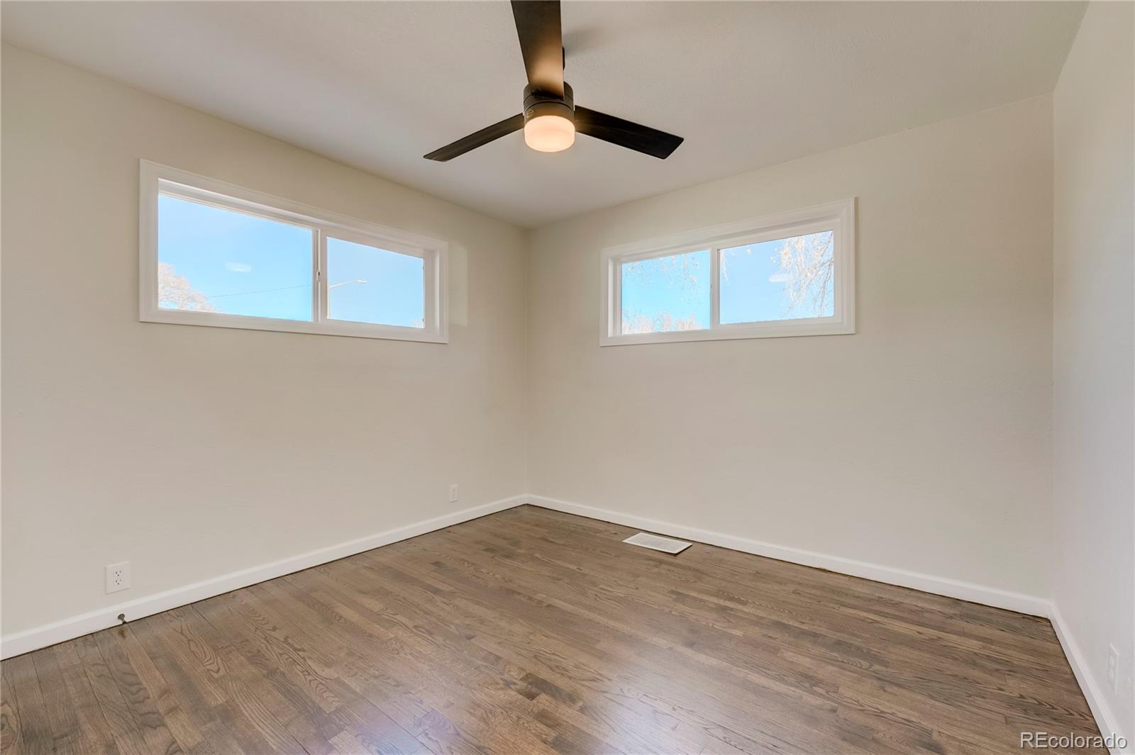 1635 South Raritan Street Denver, CO 80223 - Photo 9 of 17 a view of empty room with wooden floor