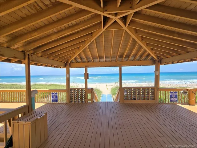 a view of balcony with wooden floor