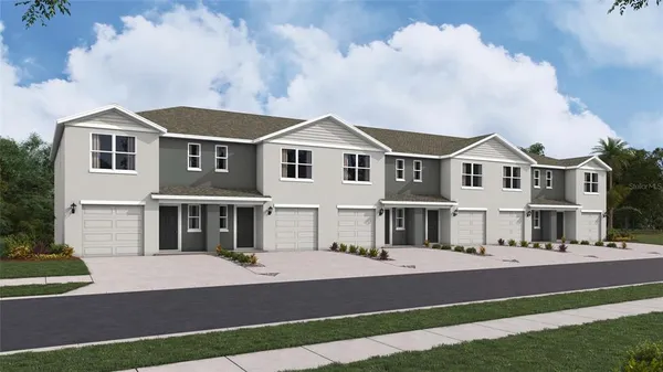 a front view of residential houses with yard