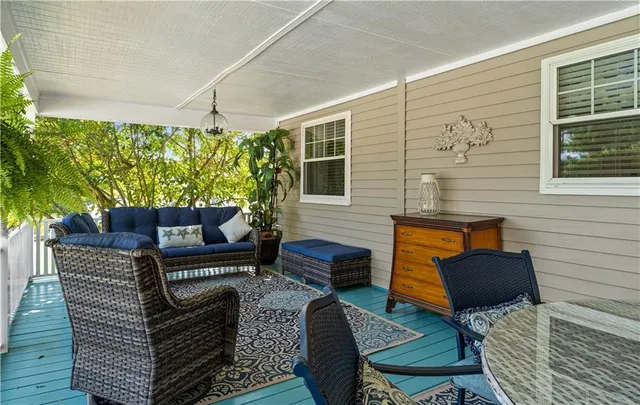 a outdoor living space with furniture and a potted plant