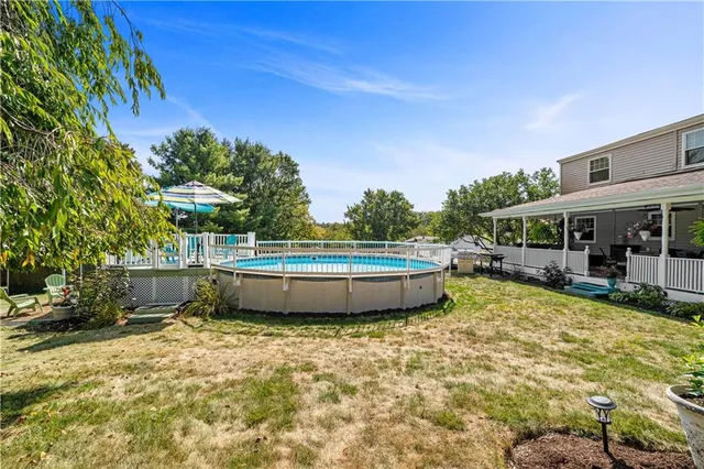 a view of a swimming pool with a patio
