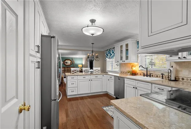 a kitchen with cabinets and window