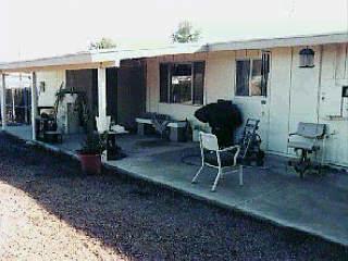 1870 West Saxony Road Tucson, AZ 85713 - Photo 5 of 5 a view of a patio with table and chairs and potted plants