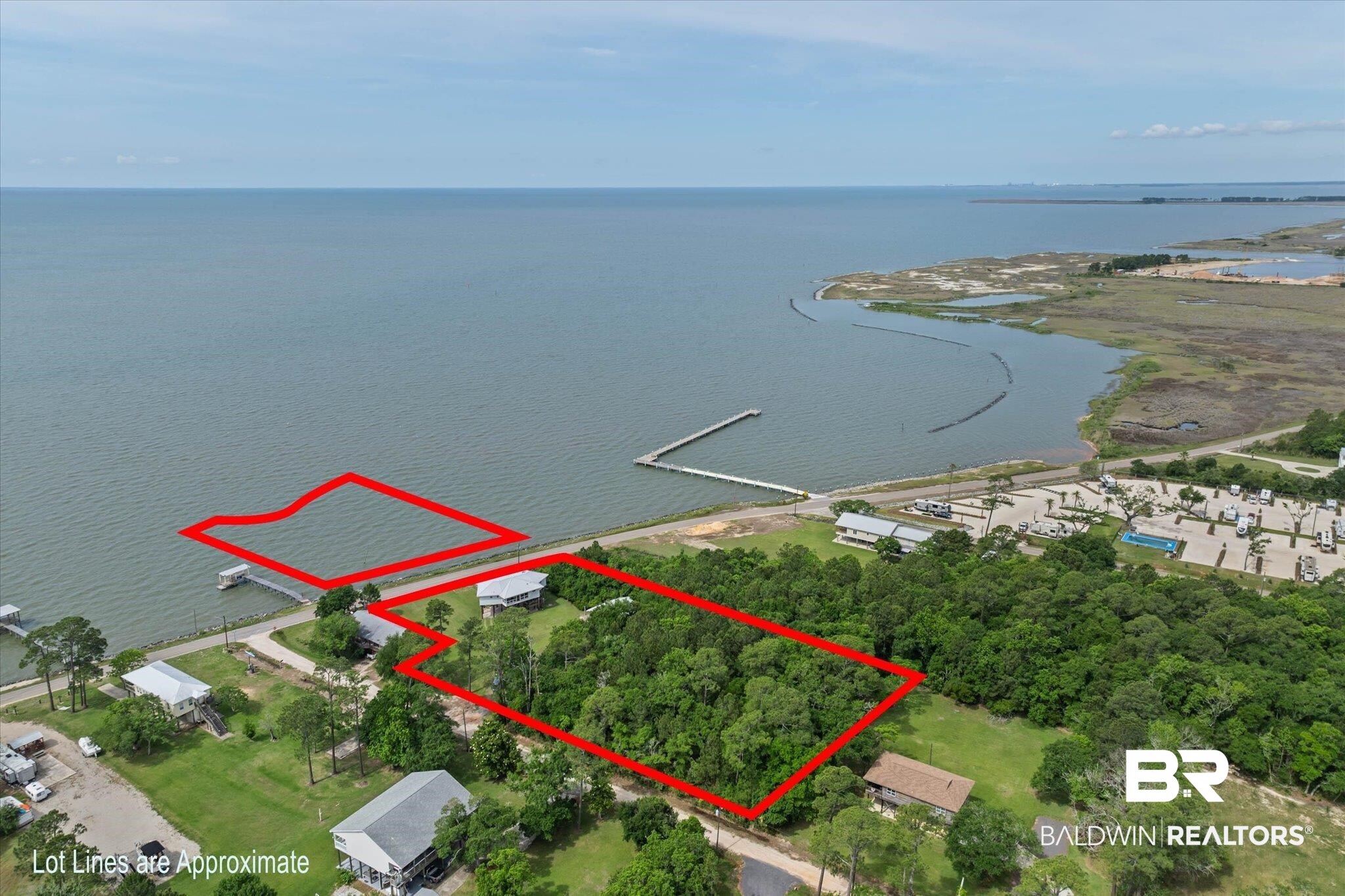 9100 Shell Belt Road Coden, AL 36523 - Photo 29 of 38 Expansive waterfront land parcel featuring direct water access, a private boat dock, and mature tree coverage