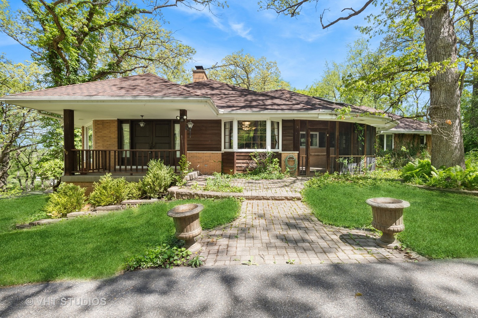 26848 Highway 22 Barrington, IL 60010 - Photo 2 of 38 a front view of a house with a yard and potted plants
