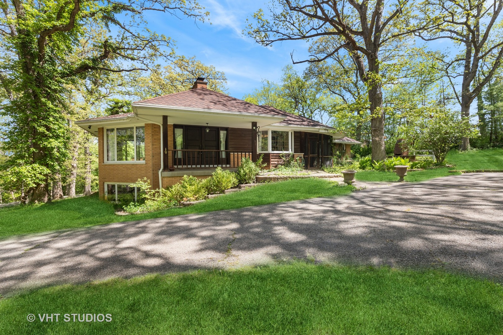 26848 Highway 22 Barrington, IL 60010 - Photo 28 of 38 a front view of a house with a garden and trees