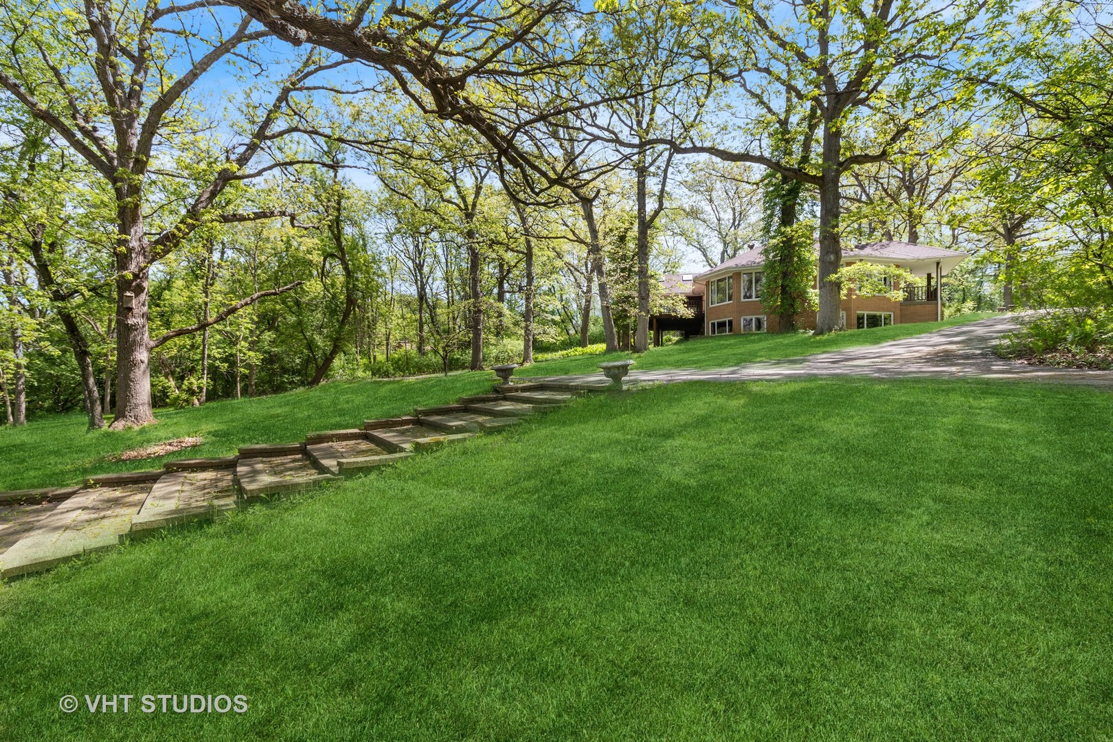 26848 Highway 22 Barrington, IL 60010 - Photo 30 of 38 a backyard of a house with lots of green space and fountain