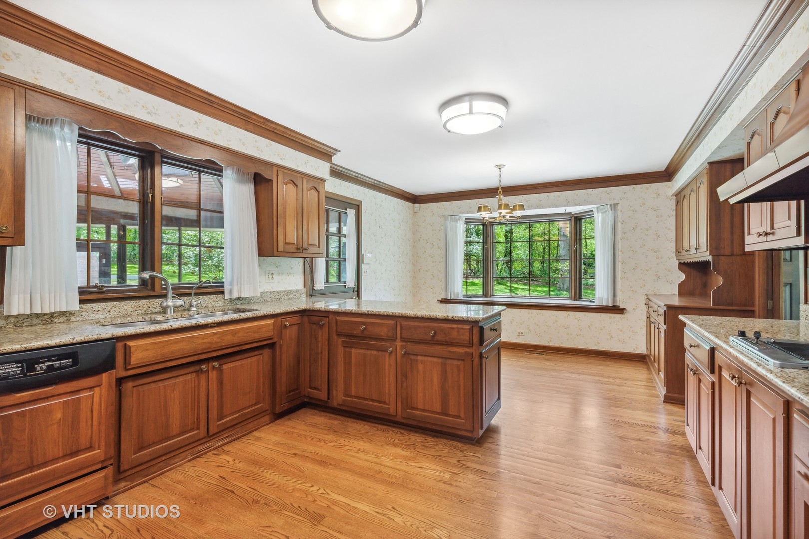 26848 Highway 22 Barrington, IL 60010 - Photo 9 of 38 a large kitchen with stainless steel appliances granite countertop a stove a sink dishwasher and a large window with wooden floor