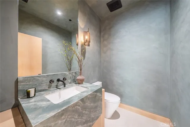 a bedroom with a bed and a walk in closet