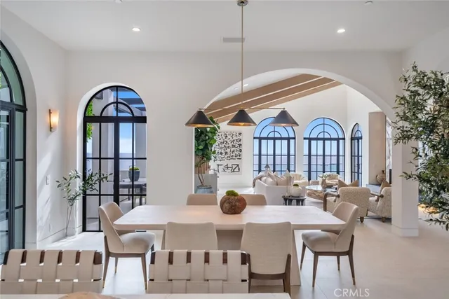 a bathroom with a granite countertop toilet sink and mirror