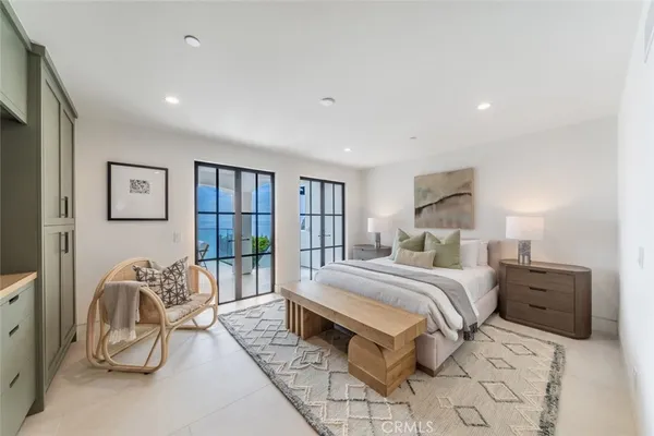 a bathroom with double vanity and a bathtub