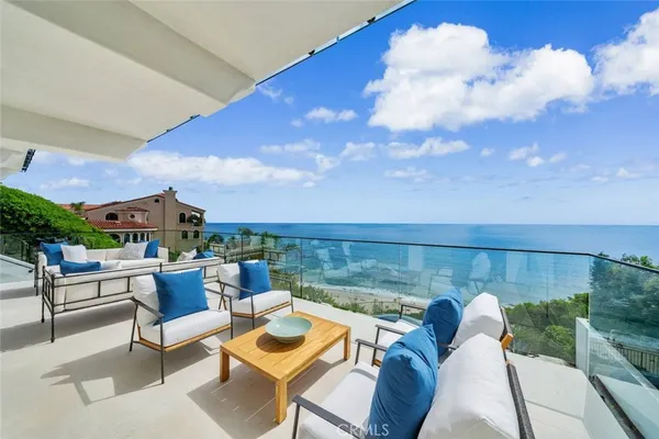 a view of a swimming pool with seating area