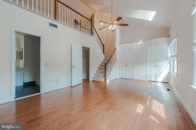 a view of an entryway with wooden floor