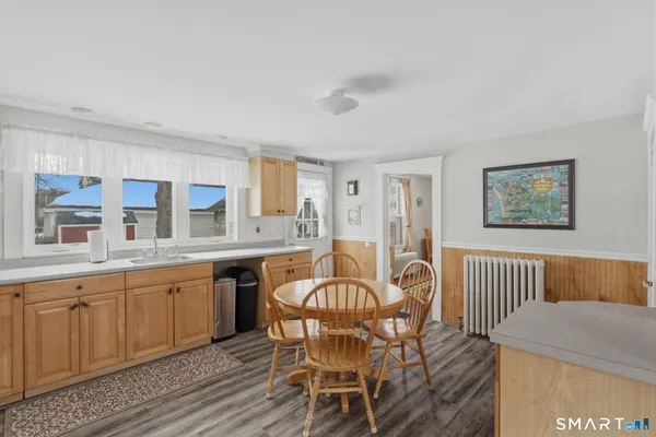 a dining room with furniture and window
