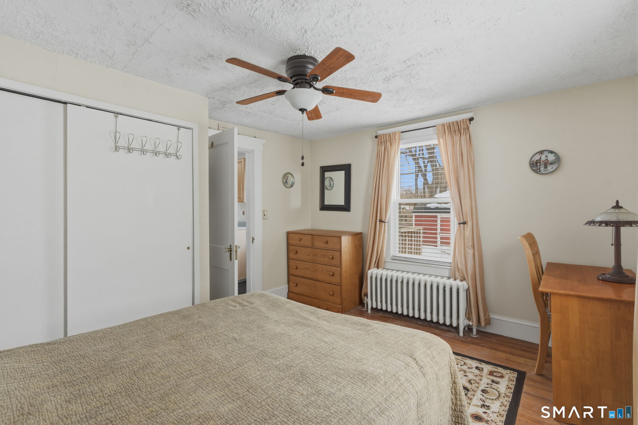 23 Benham Street Torrington, CT 06790 - Photo 17 of 28 a bedroom with a bed and a window