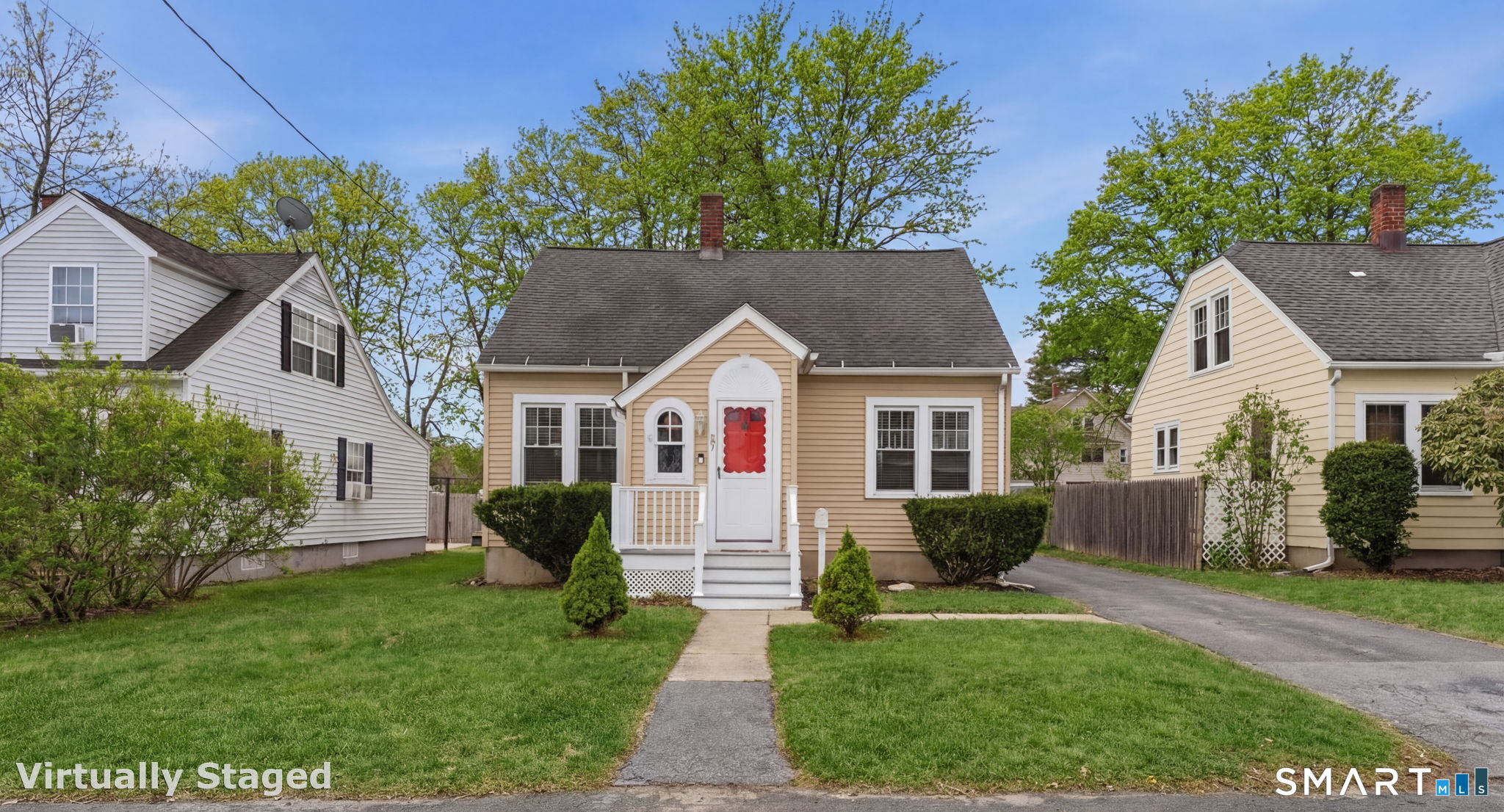 23 Benham Street Torrington, CT 06790 - Photo 24 of 28 a front view of house with yard and green space