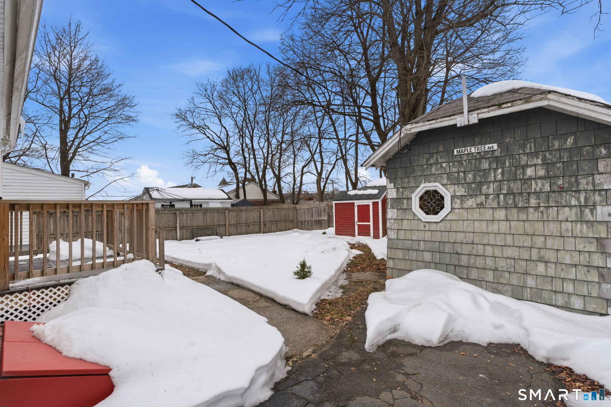 23 Benham Street Torrington, CT 06790 - Photo 25 of 28 a backyard of a house with table and chairs