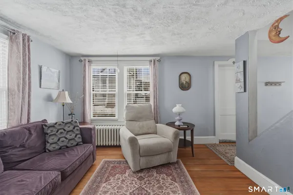 a living room with furniture and a window