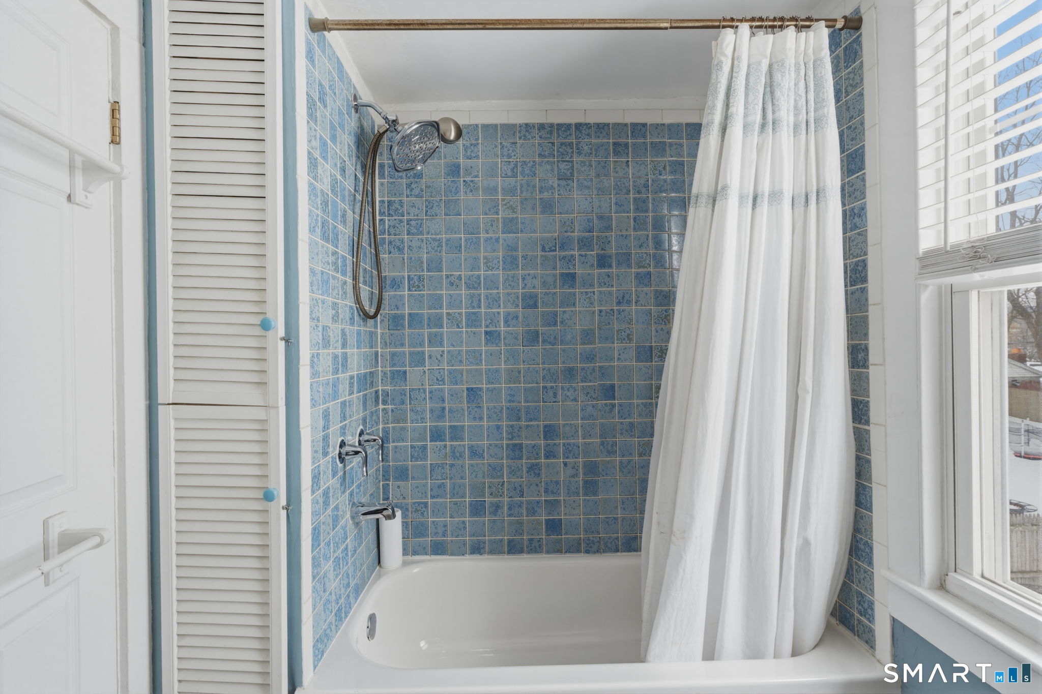 23 Benham Street Torrington, CT 06790 - Photo 4 of 28 a bathroom with a bathtub