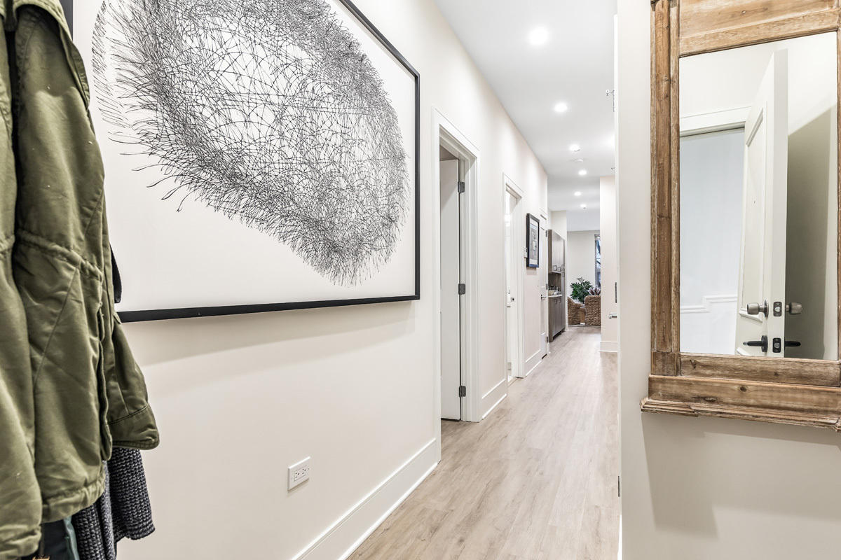435 Madison Street, Unit 207 Oak Park, IL 60302 - Photo 18 of 21 a view of a hallway with wooden floor and staircase