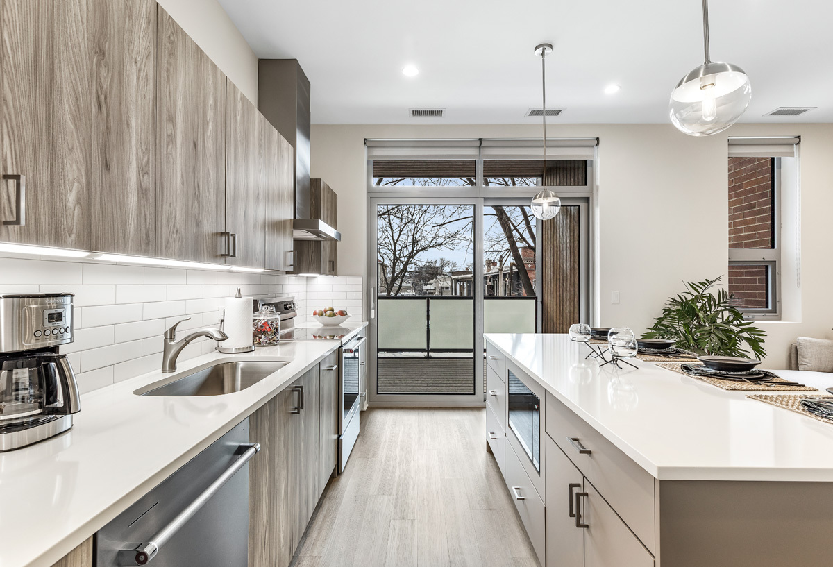 435 Madison Street, Unit 207 Oak Park, IL 60302 - Photo 3 of 21 a kitchen with a sink stove and cabinets