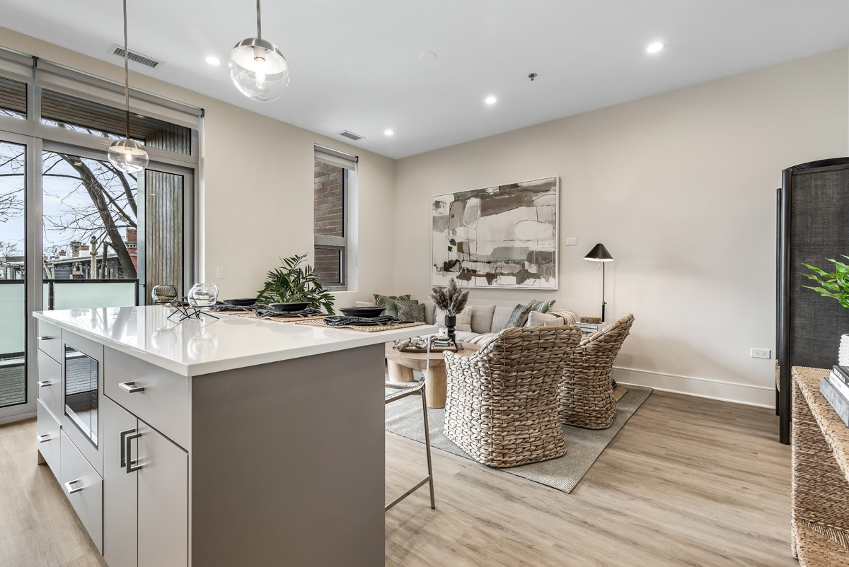 435 Madison Street, Unit 207 Oak Park, IL 60302 - Photo 4 of 21 a room with stainless steel appliances lots of wooden furniture a large window in it