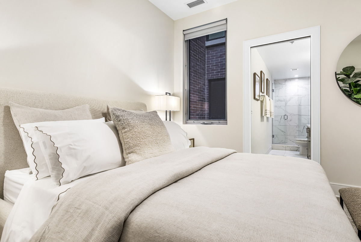 435 Madison Street, Unit 207 Oak Park, IL 60302 - Photo 10 of 21 a bedroom with a large bed and a chandelier