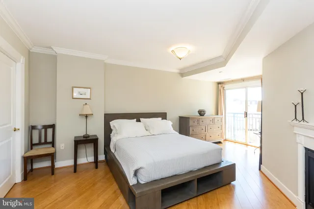 a bedroom with a bed and a table