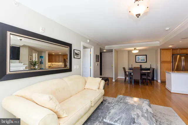 a bedroom with a bed and a potted plant