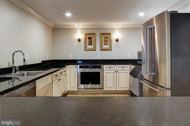 a room with furniture pool table and chairs