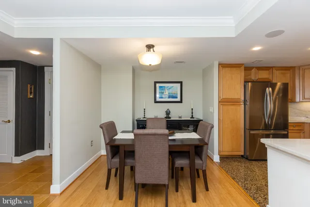 a view of a dining room with furniture and a chandelier