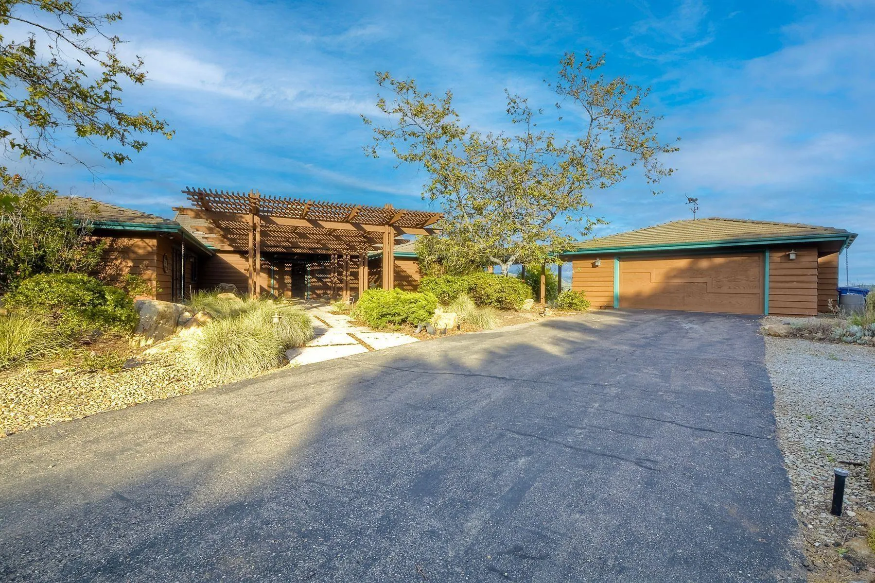 14825 Midland Road Poway, CA 92064 - Photo 13 of 33 a view of a house with a yard and garage