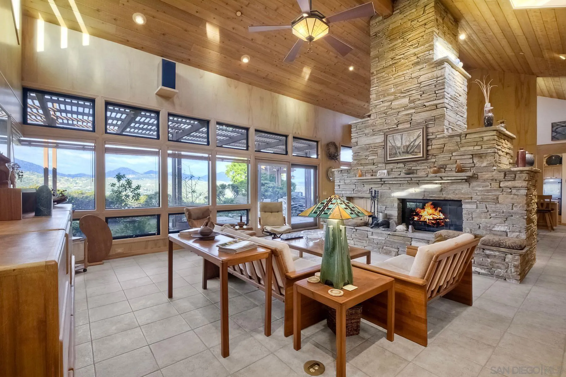 14825 Midland Road Poway, CA 92064 - Photo 16 of 33 a living room with furniture a fireplace and a table