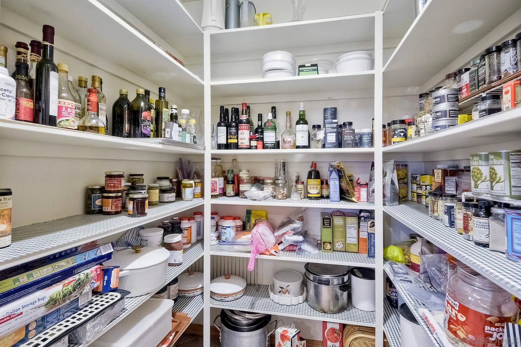 14825 Midland Road Poway, CA 92064 - Photo 21 of 33 a room with stainless steel appliances lots of different kinds of food