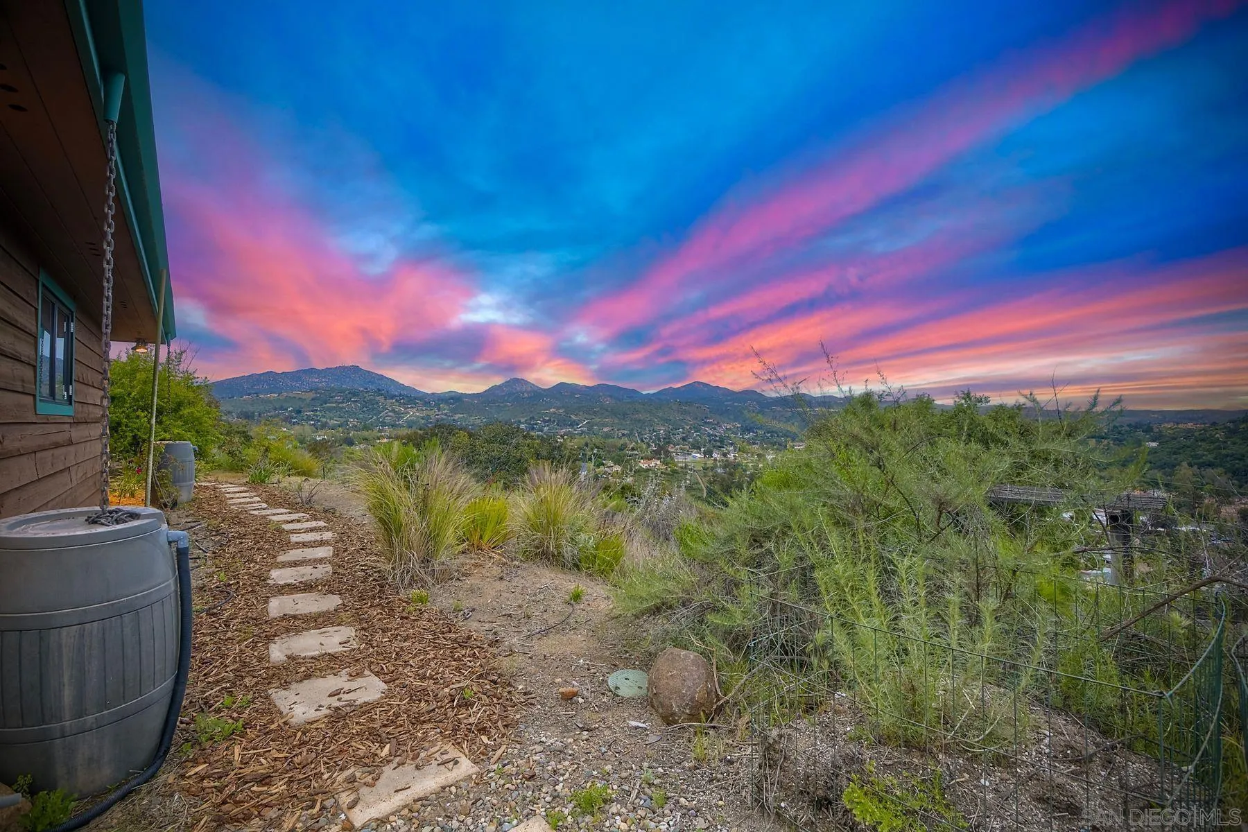 14825 Midland Road Poway, CA 92064 - Photo 31 of 33 a view of a lake with a building in the background
