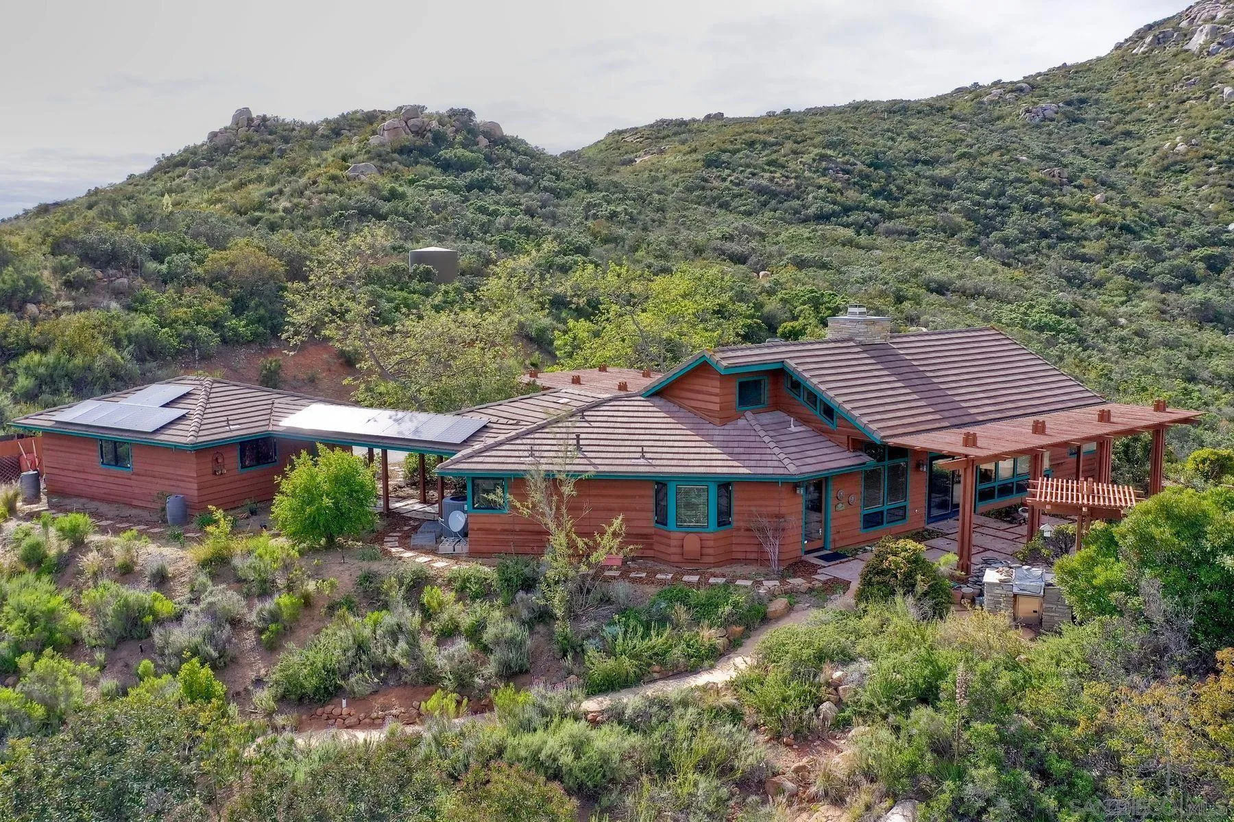 14825 Midland Road Poway, CA 92064 - Photo 8 of 33 a view of a house with a yard plants and large tree