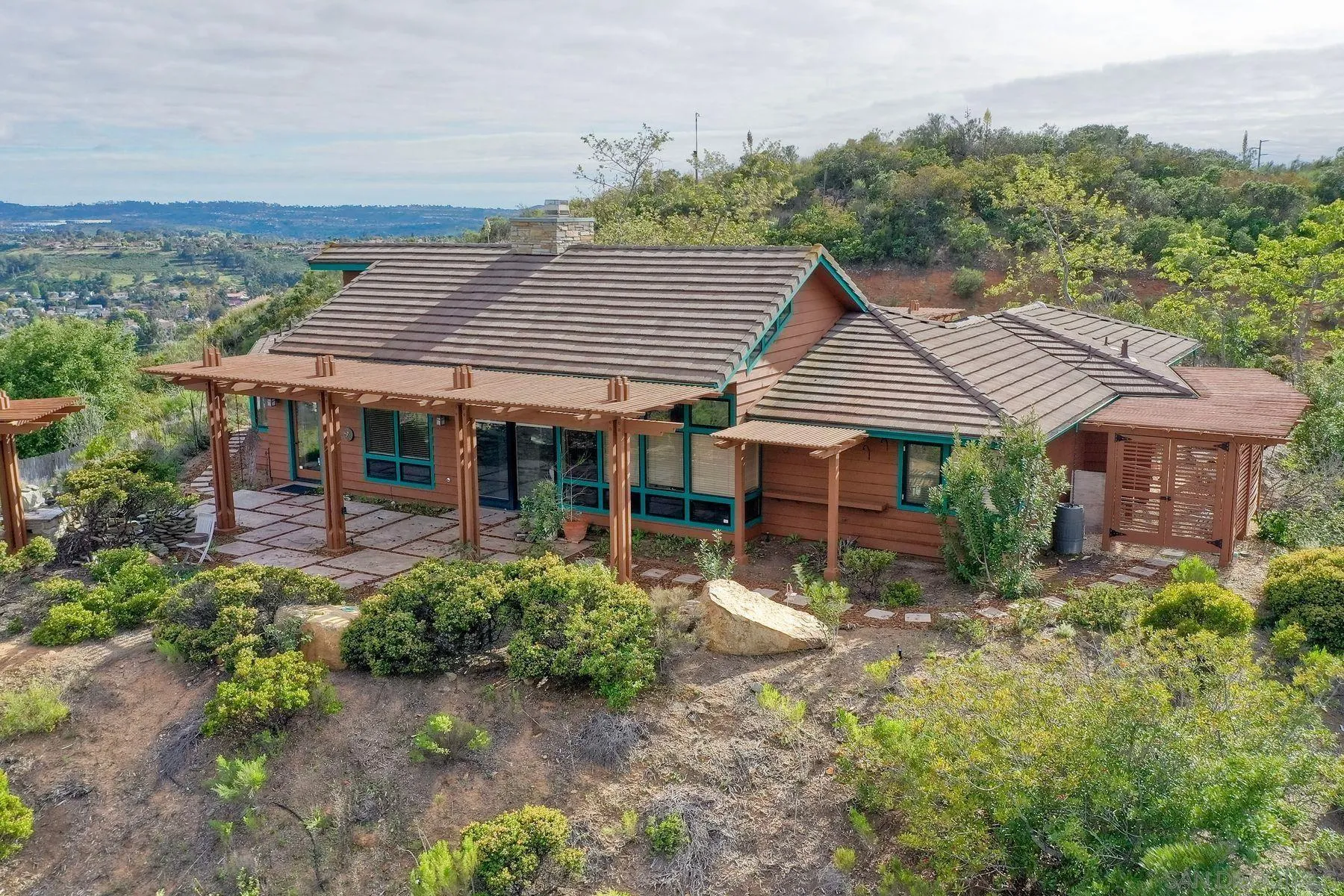 14825 Midland Road Poway, CA 92064 - Photo 9 of 33 a front view of a house with garden