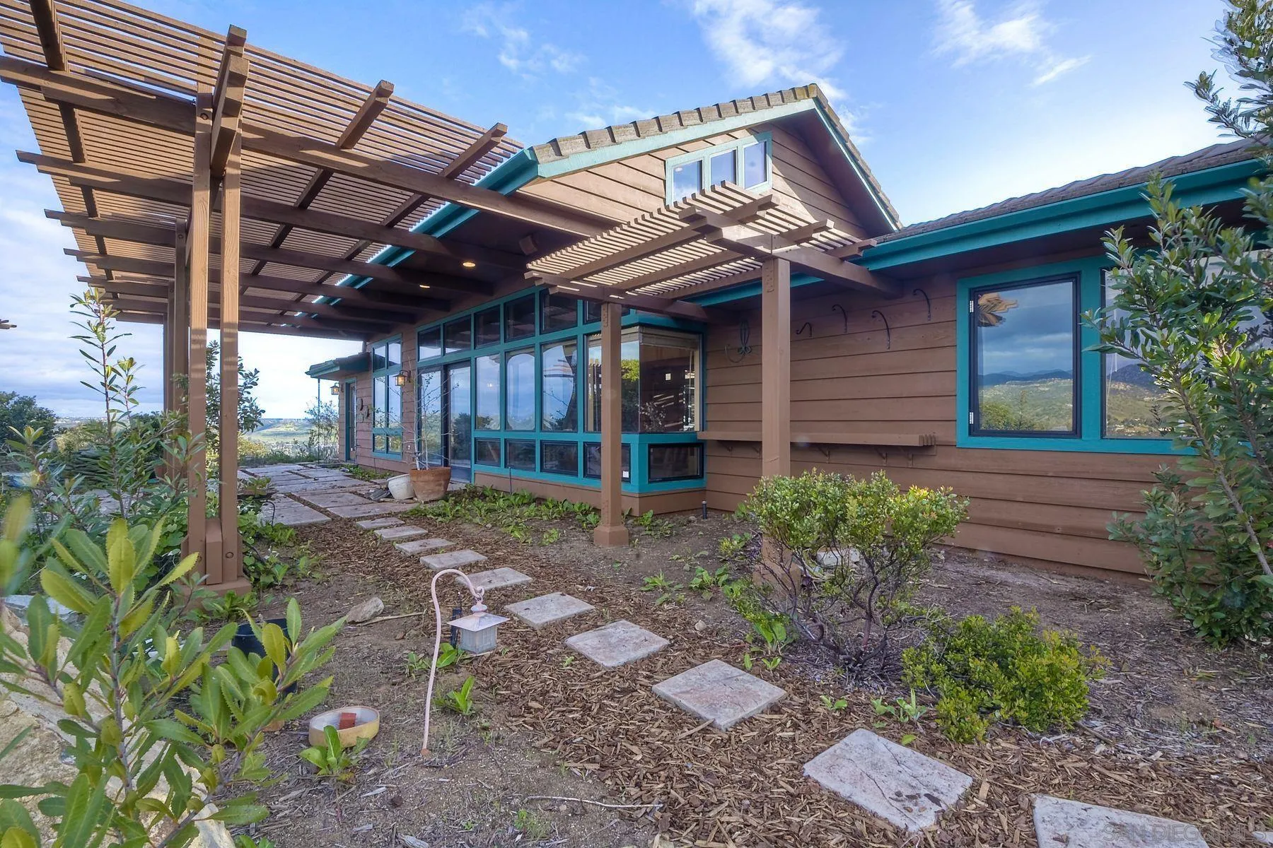 14825 Midland Road Poway, CA 92064 - Photo 10 of 33 a view of a backyard with plants and large trees