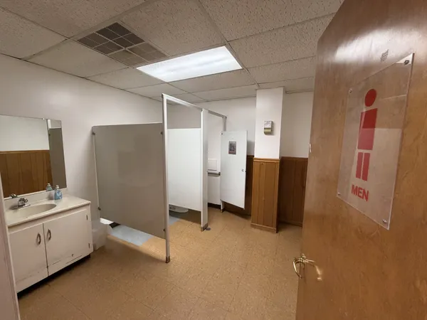 a utility room with closet dryer and washer
