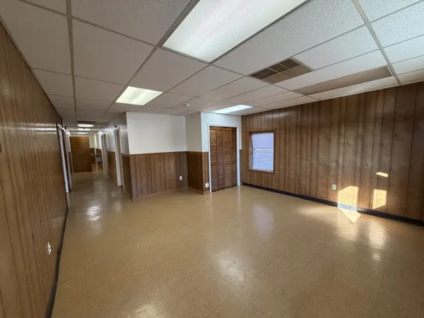 a view of a hall with an empty room