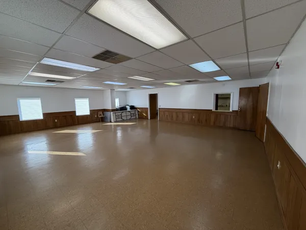 a view of a room with lots of wooden furniture