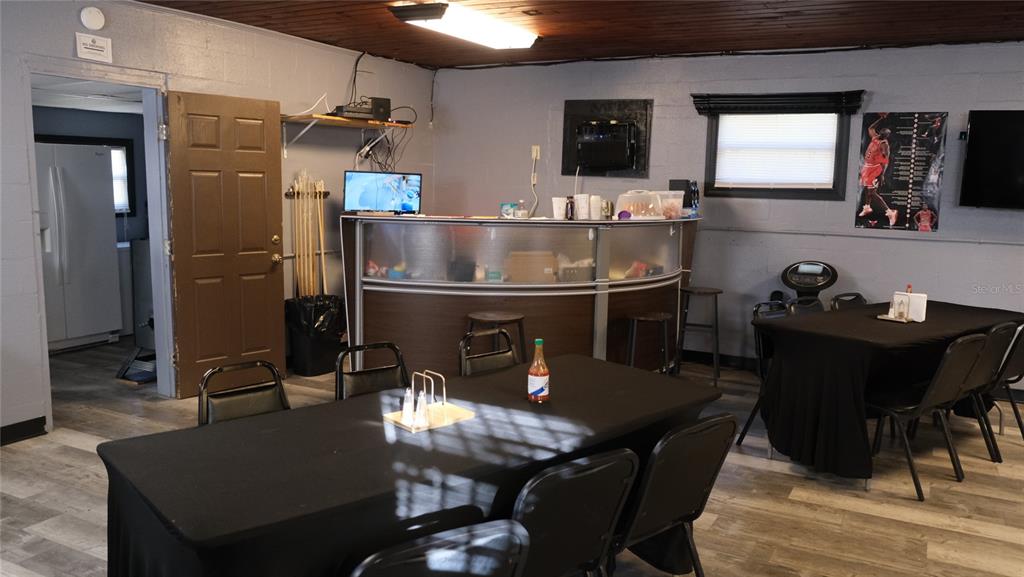 34 4th Street Southwest Fort Meade, FL 33841 - Photo 13 of 31 a kitchen with a dining table and chairs