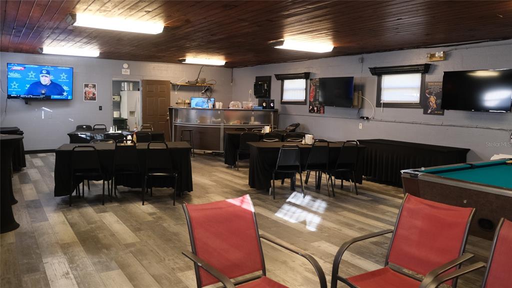 34 4th Street Southwest Fort Meade, FL 33841 - Photo 14 of 31 a kitchen with a dining table chairs and a refrigerator
