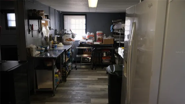 a room with a walk in closet and a mirror